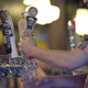 A bartender pouring a glass of 5 Rabbit’s controversial beer